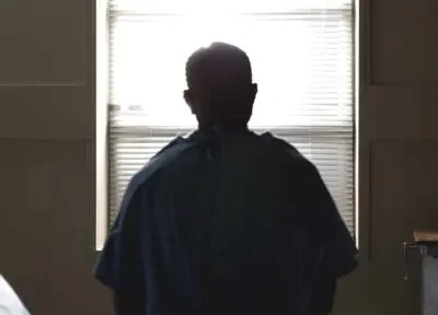 patient sitting alone in hospital room