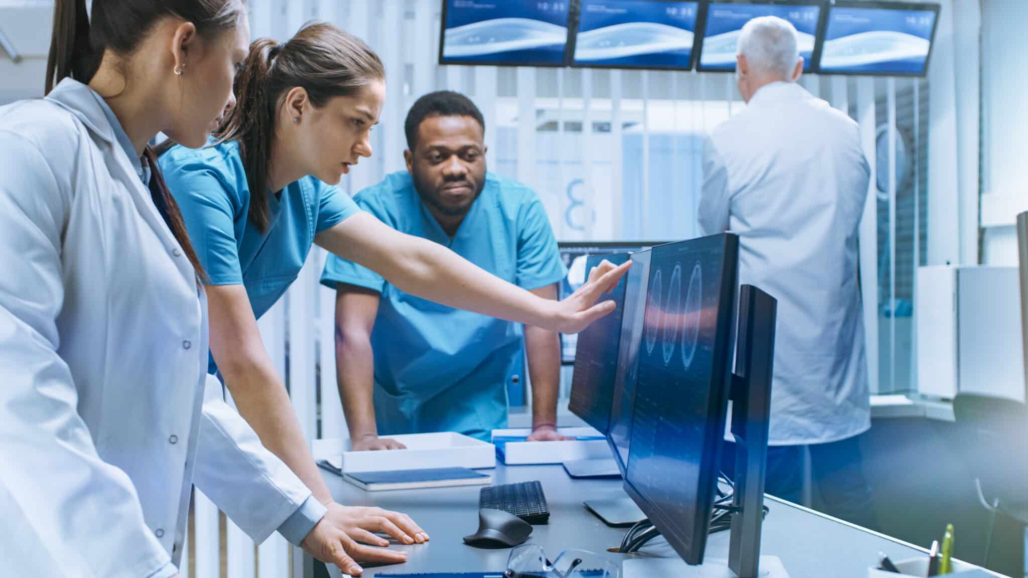 Diverse,Team,Of,Medical,Scientists,Solve,Problems,And,Point,At