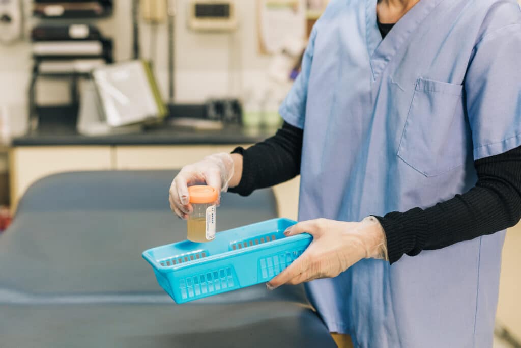 Doctor performs labs in emergency department.