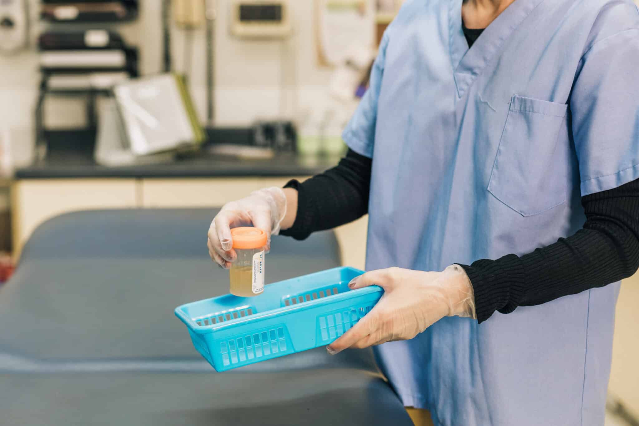 Doctor performs labs in emergency department.