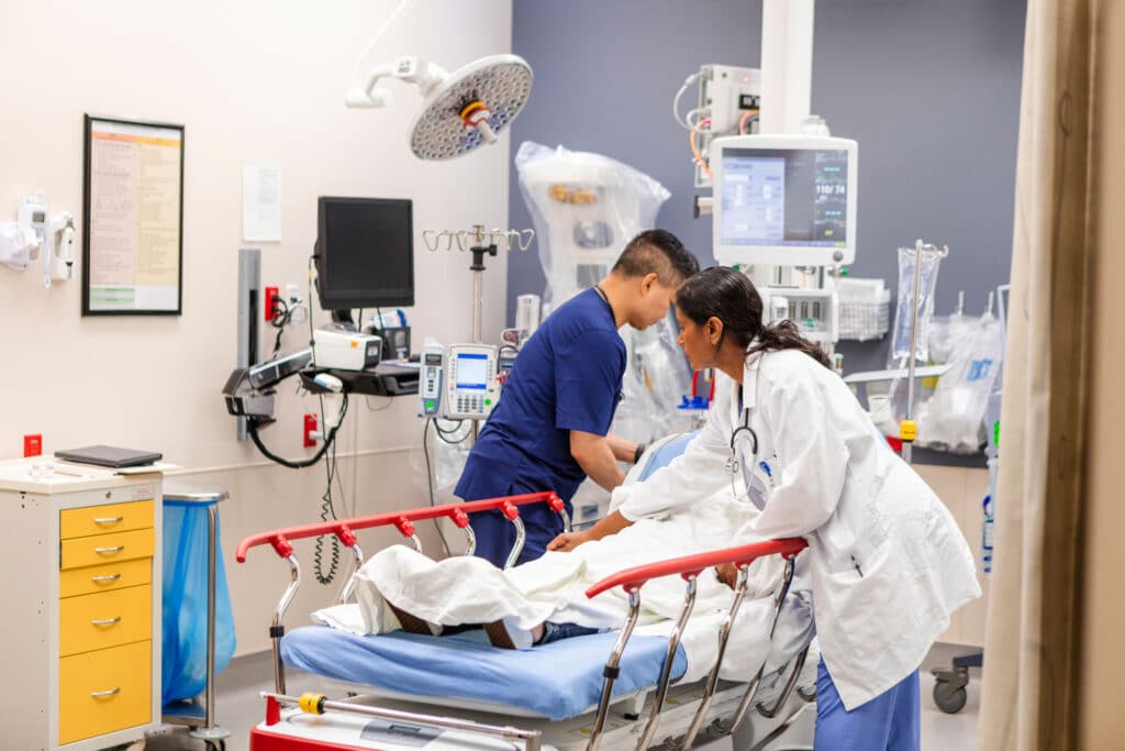 Doctors work on a patient in the Emergency Department