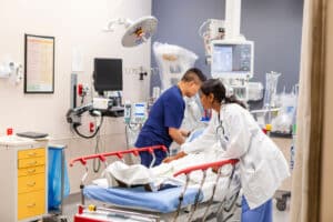 Doctors work on a patient in the Emergency Department